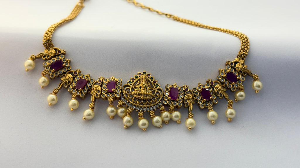 Traditional Lakshmi Temple Necklace with Ruby Stones & Pearl Drops – Antique Gold Finish