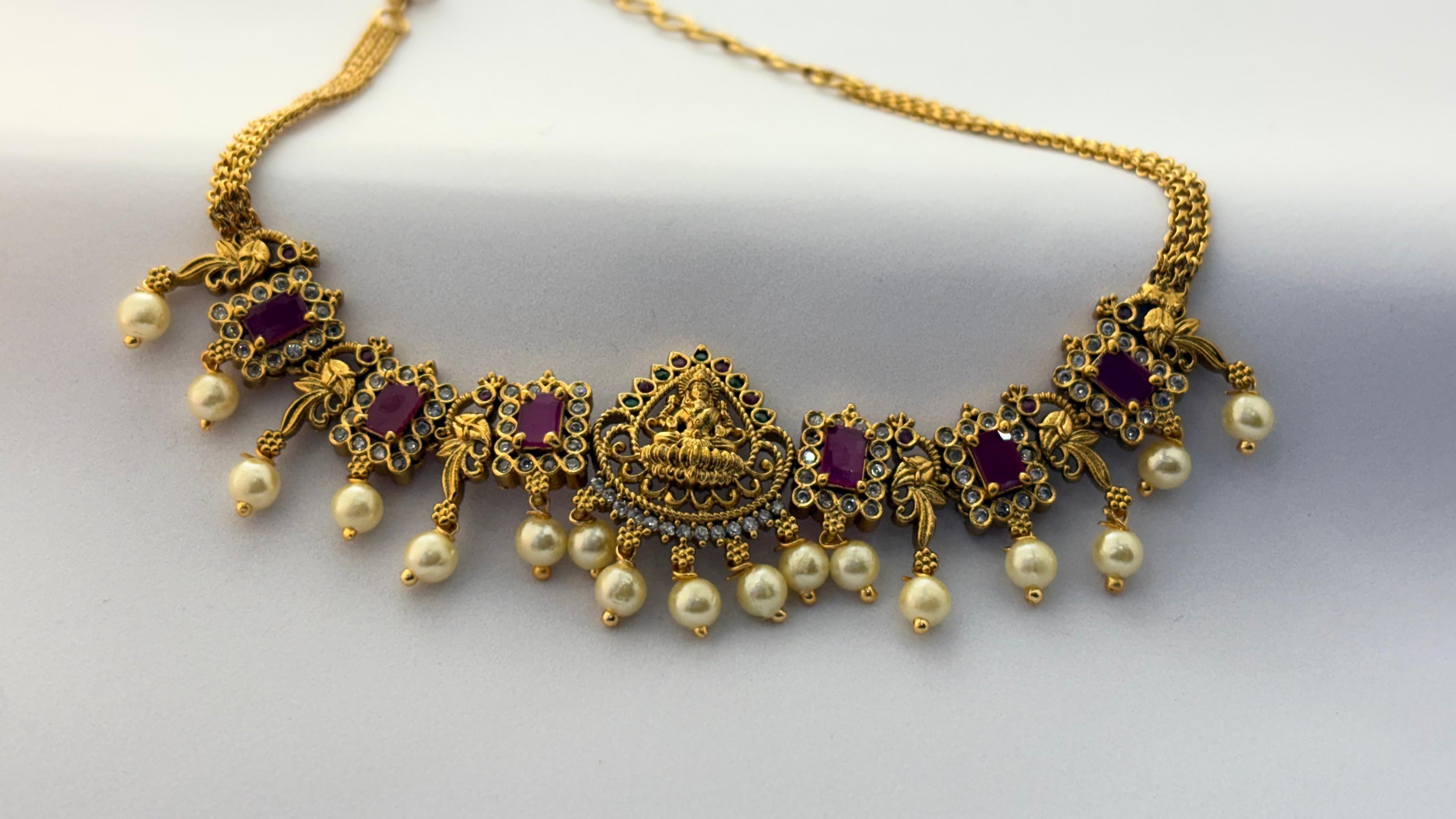 Traditional Lakshmi Temple Necklace with Ruby Stones & Pearl Drops – Antique Gold Finish